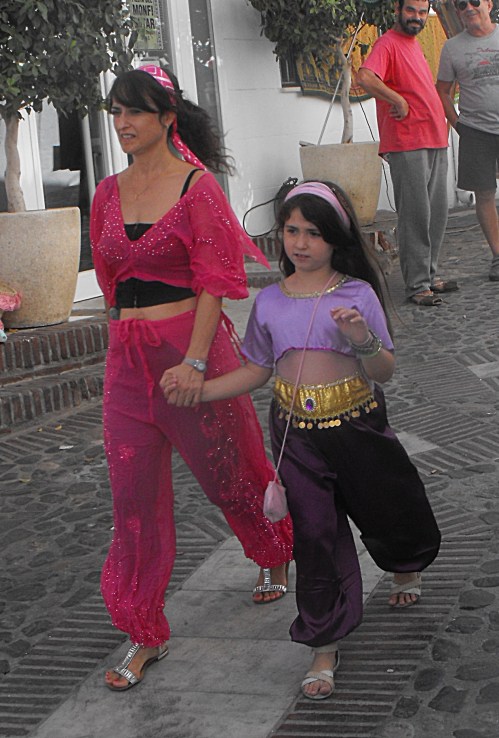 Moorish Mum and daughter fleeing the village watched by Christian onlookers