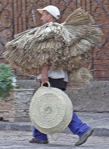 Travelling salesman with his brooms and brushes