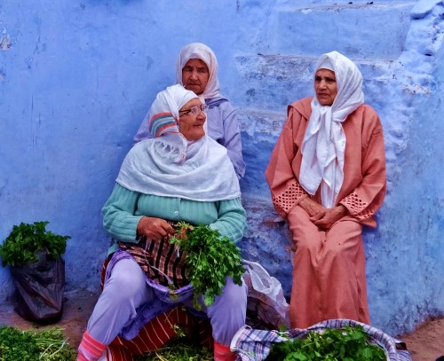 Women selling mint and coriander in the medina at Chefchouen